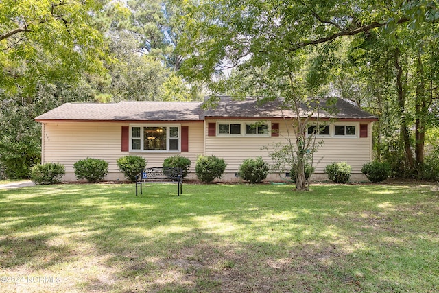 ranch-style house with a front lawn