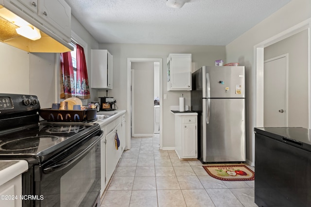 kitchen featuring stainless steel fridge, a textured ceiling, light tile patterned floors, electric range, and white cabinets