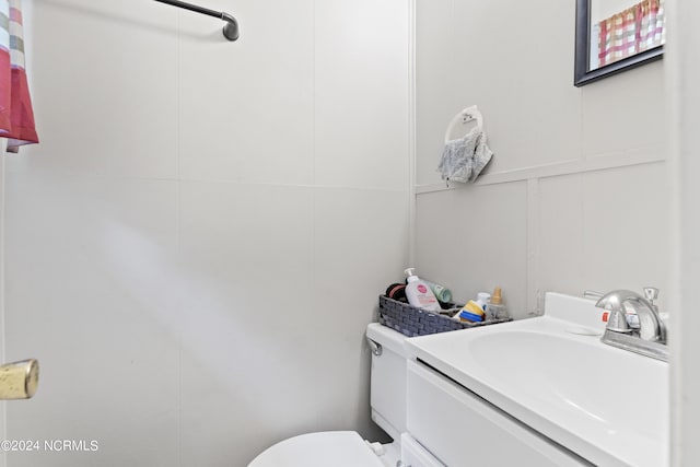 half bath with toilet and vanity