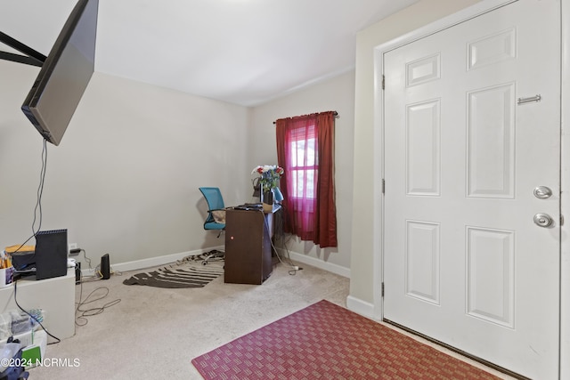 carpeted office space featuring baseboards