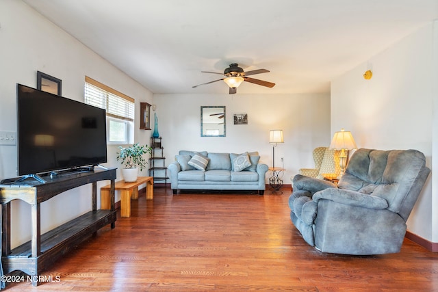 living room featuring hardwood / wood-style flooring and ceiling fan