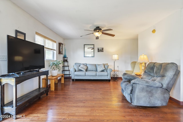 living room featuring wood finished floors and a ceiling fan