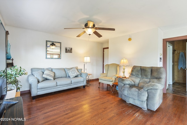 living area with a ceiling fan and wood finished floors