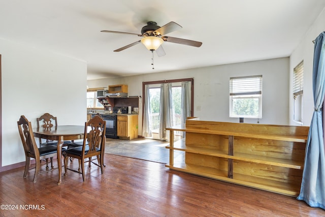 dining area featuring ceiling fan and wood finished floors