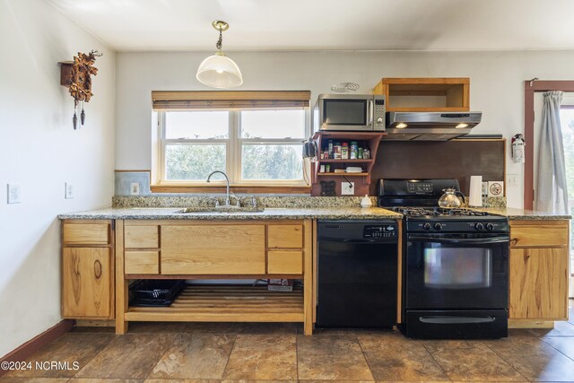 kitchen featuring black appliances, sink, light stone countertops, decorative light fixtures, and extractor fan