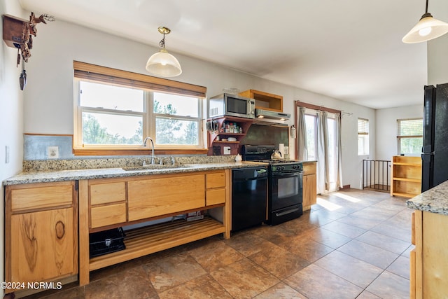 kitchen featuring black appliances, decorative light fixtures, backsplash, and sink