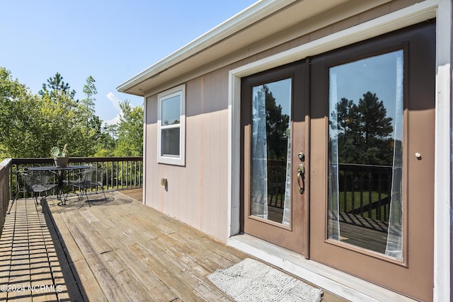 wooden deck featuring french doors