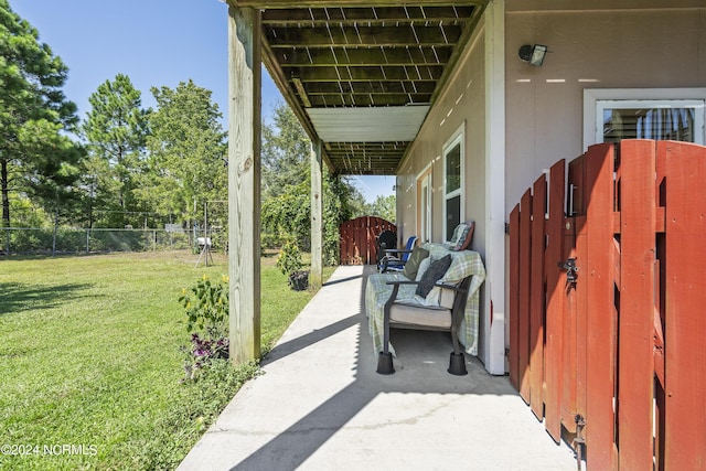 view of patio featuring a gate and fence