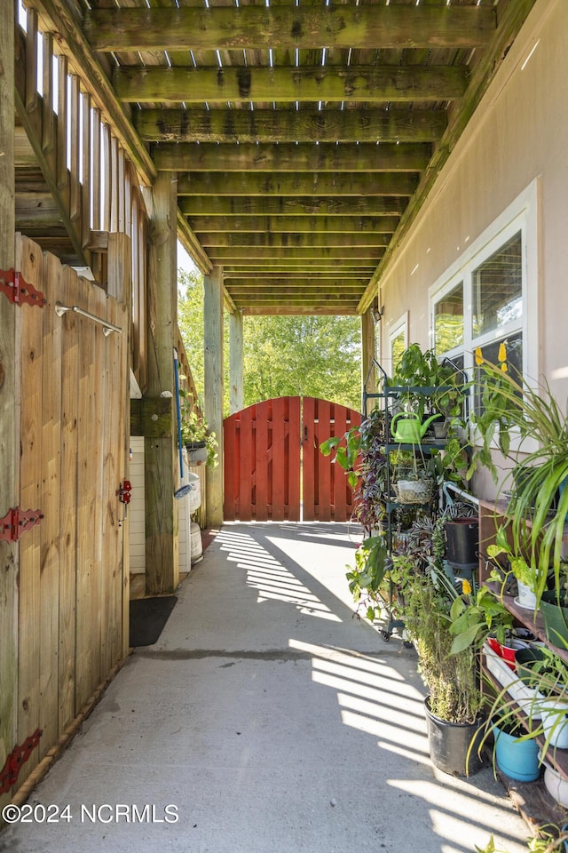 view of patio with a gate