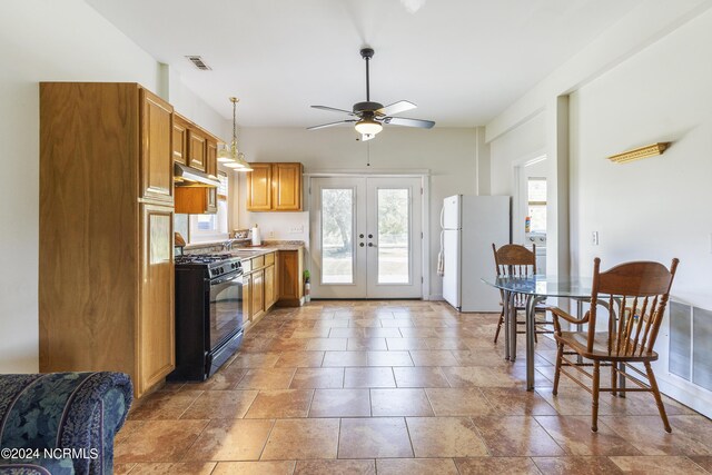 kitchen with ceiling fan, french doors, sink, black range with gas cooktop, and white fridge