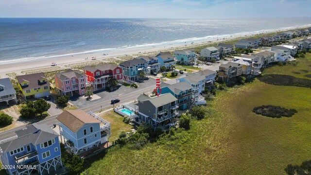 birds eye view of property featuring a water view and a view of the beach