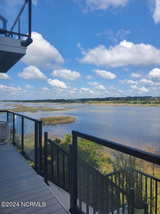 birds eye view of property featuring a view of the beach and a water view