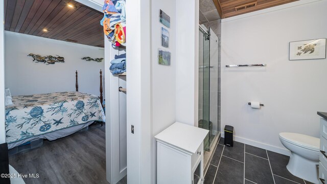 clothes washing area with water heater and independent washer and dryer