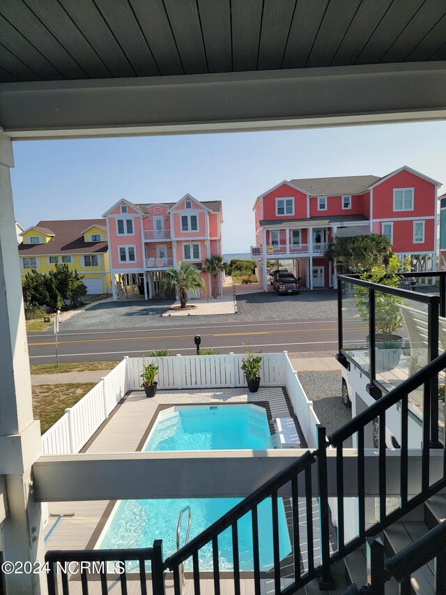 view of side of home featuring a balcony