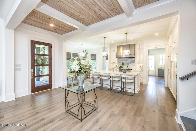 6404 Westport Dr, Wilmington, NC 28409 - entrance foyer with beamed ceiling, recessed lighting, light wood-style flooring, and baseboards