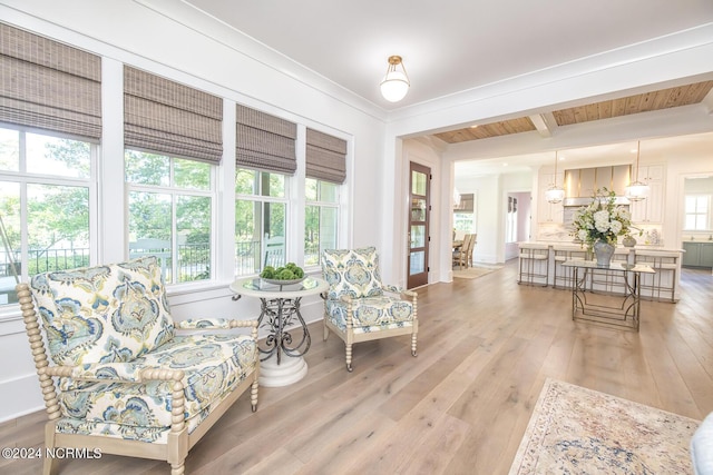 6404 Westport Dr, Wilmington, NC 28409 - living area featuring light wood-style flooring and beamed ceiling