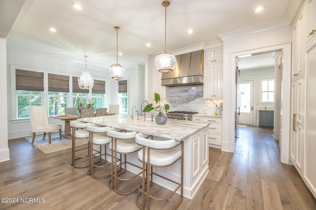 6404 Westport Dr, Wilmington, NC 28409 - kitchen featuring tasteful backsplash, white cabinets, crown molding, and recessed lighting