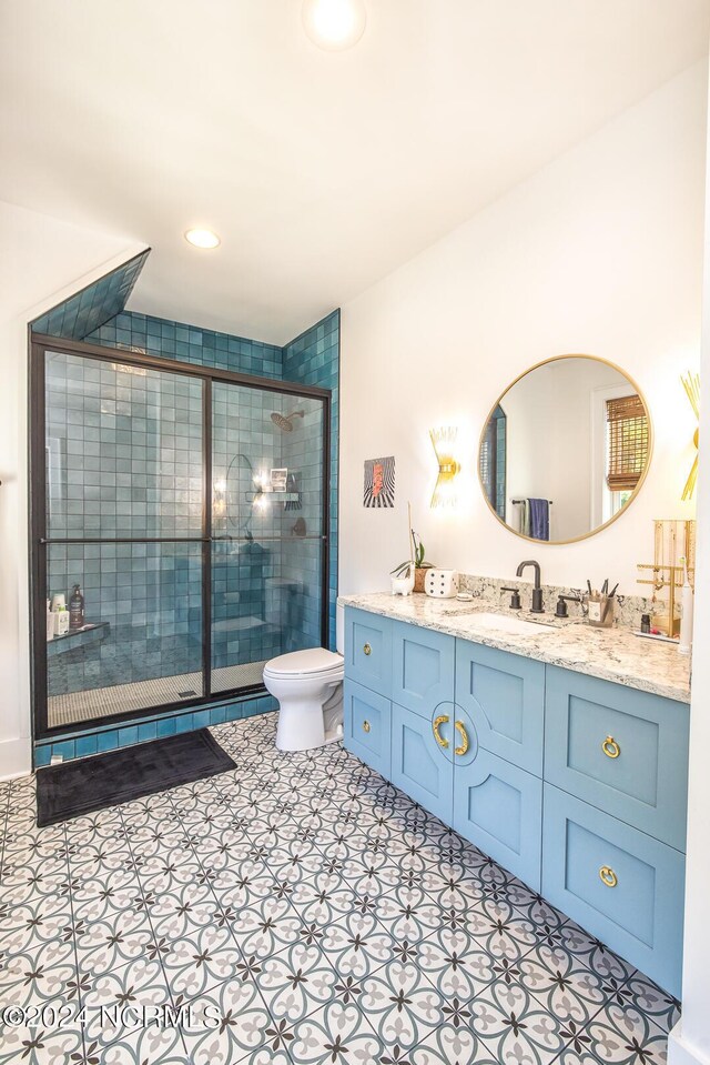 6404 Westport Dr, Wilmington, NC 28409 - full bath featuring vanity, toilet, a shower stall, recessed lighting, and tile patterned floors
