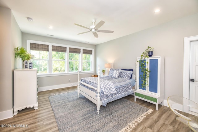 6404 Westport Dr, Wilmington, NC 28409 - bedroom featuring baseboards, wood finished floors, recessed lighting, and a ceiling fan