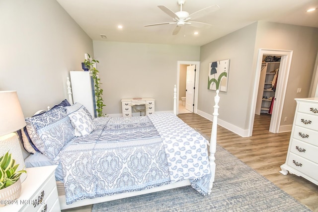 6404 Westport Dr, Wilmington, NC 28409 - bedroom featuring a spacious closet, light wood-style flooring, baseboards, recessed lighting, and a closet