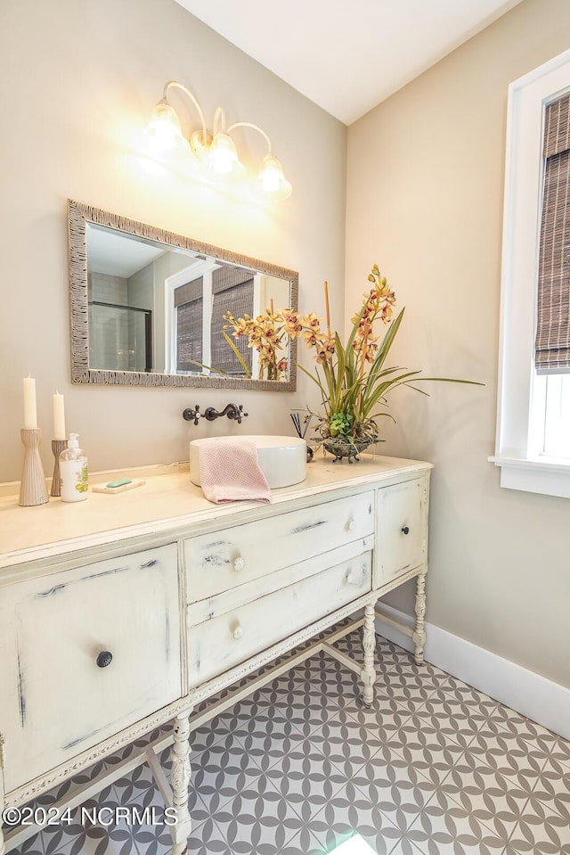 6404 Westport Dr, Wilmington, NC 28409 - bathroom with vanity and baseboards