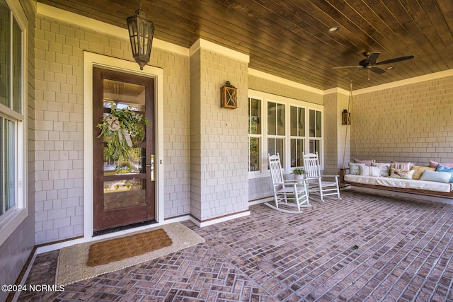 6404 Westport Dr, Wilmington, NC 28409 - property entrance featuring ceiling fan, a porch, and an outdoor hangout area