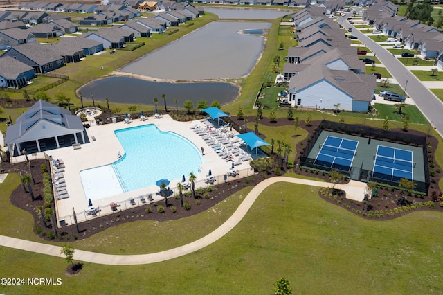 birds eye view of property featuring a water view