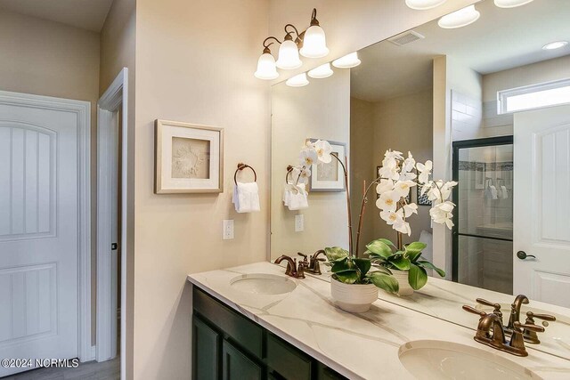 bathroom with vanity and walk in shower