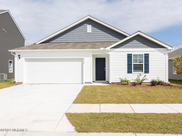 view of front of home with a garage, central air condition unit, and a front lawn