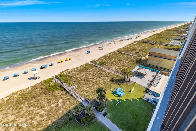 birds eye view of property featuring a water view and a view of the beach