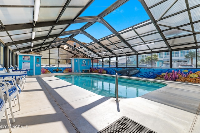 pool with a patio and a lanai