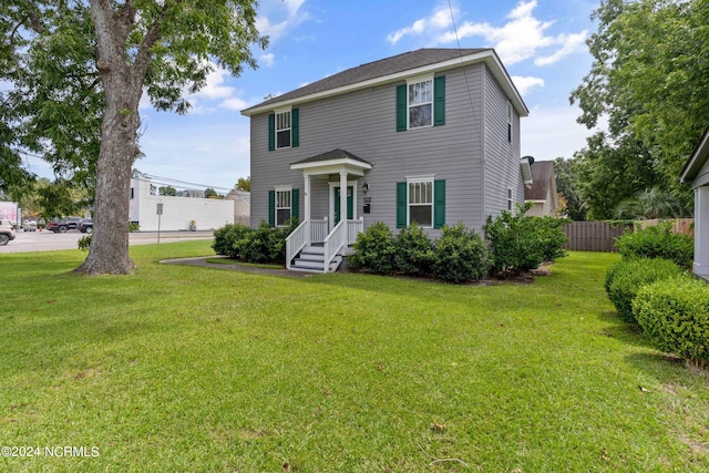 colonial inspired home with a front yard