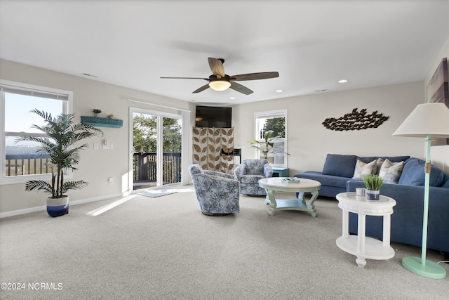 living area featuring visible vents, baseboards, ceiling fan, carpet floors, and recessed lighting