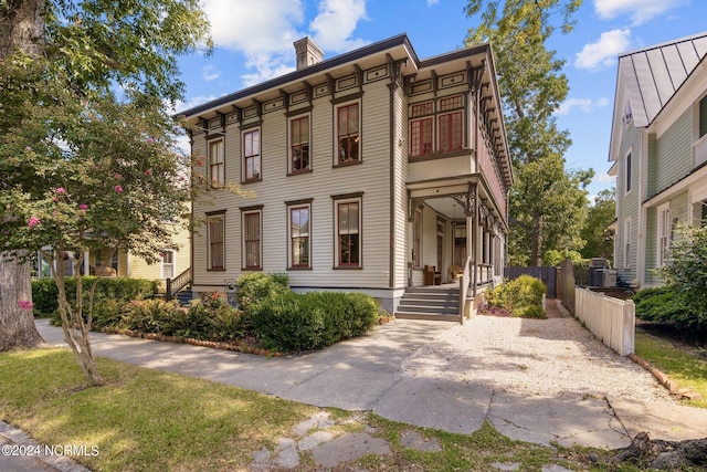 view of front of house featuring fence