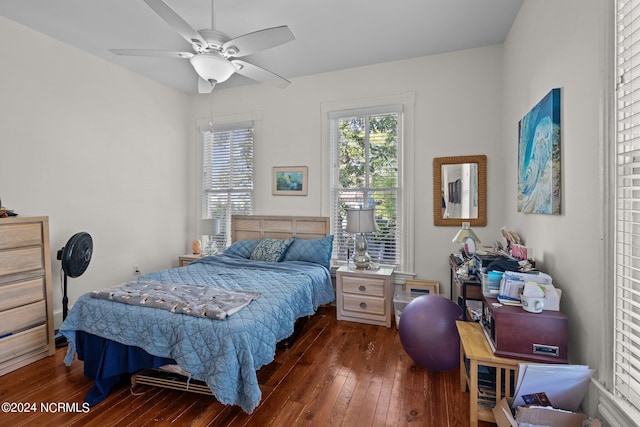 bedroom featuring ceiling fan and dark wood-style flooring