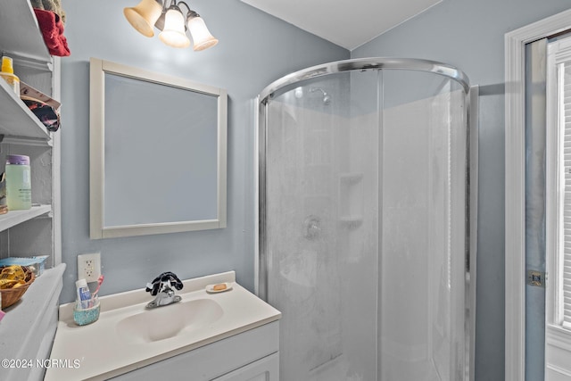 bathroom with vanity and a shower stall