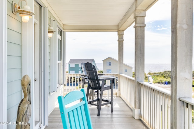 balcony featuring a water view