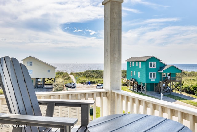 balcony featuring a water view