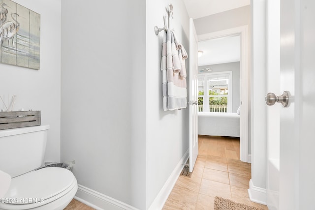 bathroom with tile patterned flooring and toilet