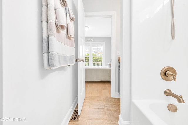 bathroom with plus walk in shower and tile patterned flooring