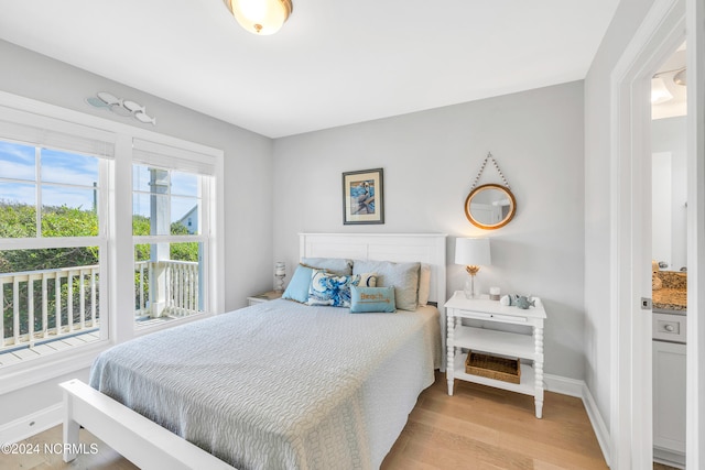 bedroom with light hardwood / wood-style floors