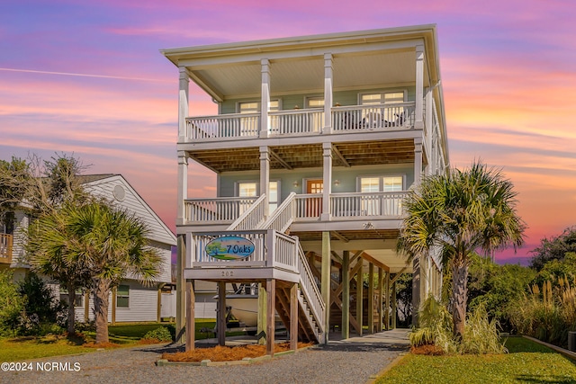 coastal inspired home featuring covered porch