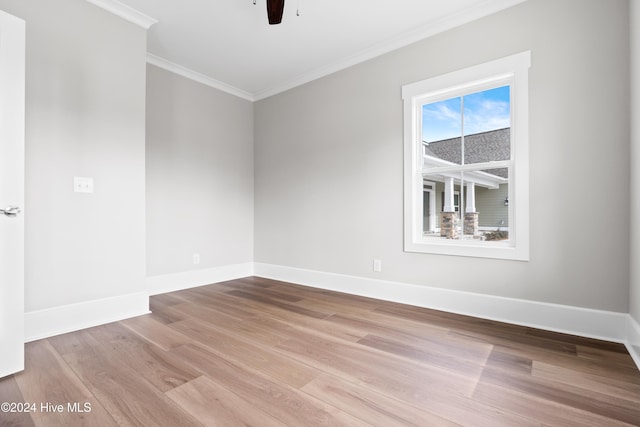 empty room with light hardwood / wood-style floors, ceiling fan, and ornamental molding