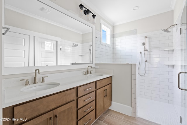 bathroom featuring vanity, an enclosed shower, and ornamental molding