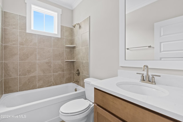 full bathroom with vanity, toilet, tiled shower / bath, and ornamental molding