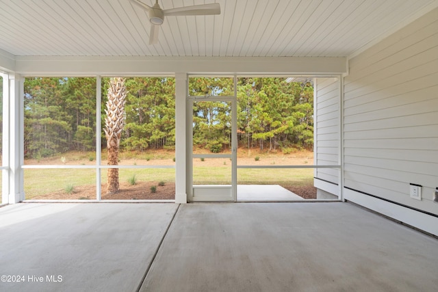 unfurnished sunroom with ceiling fan and a healthy amount of sunlight