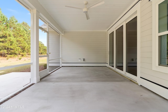 unfurnished sunroom with ceiling fan and a healthy amount of sunlight