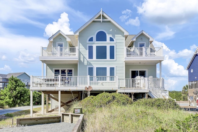 exterior space featuring stairway and a balcony