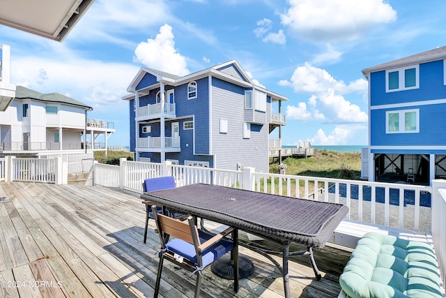 wooden deck with a water view