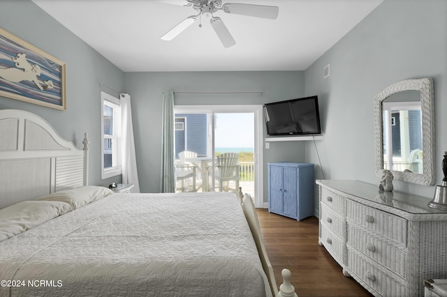 bedroom with access to exterior, dark wood-style flooring, multiple windows, and a ceiling fan